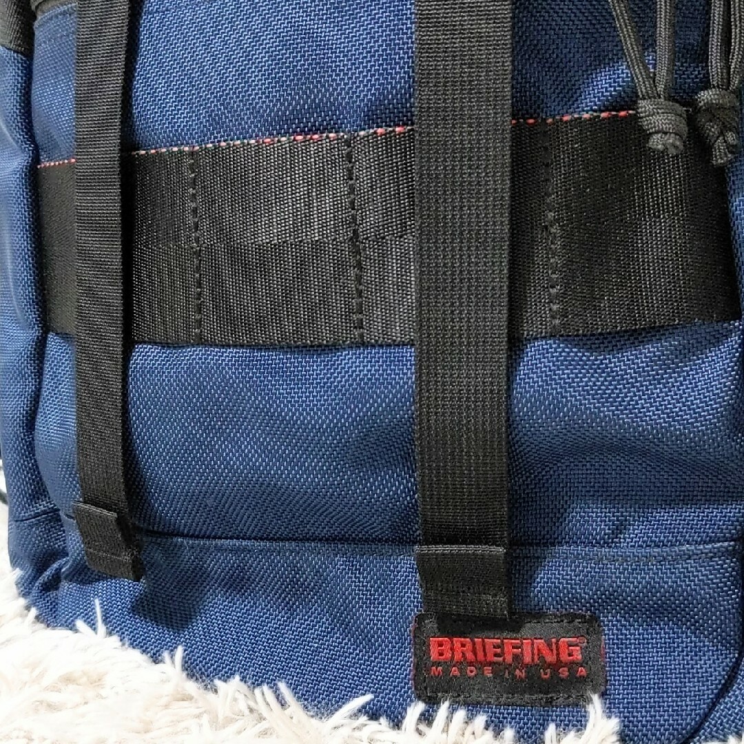 BRIEFING(ブリーフィング)の美品 BRIEFING トゥモローランド 別注 FLAP PACK USA 青 メンズのバッグ(バッグパック/リュック)の商品写真