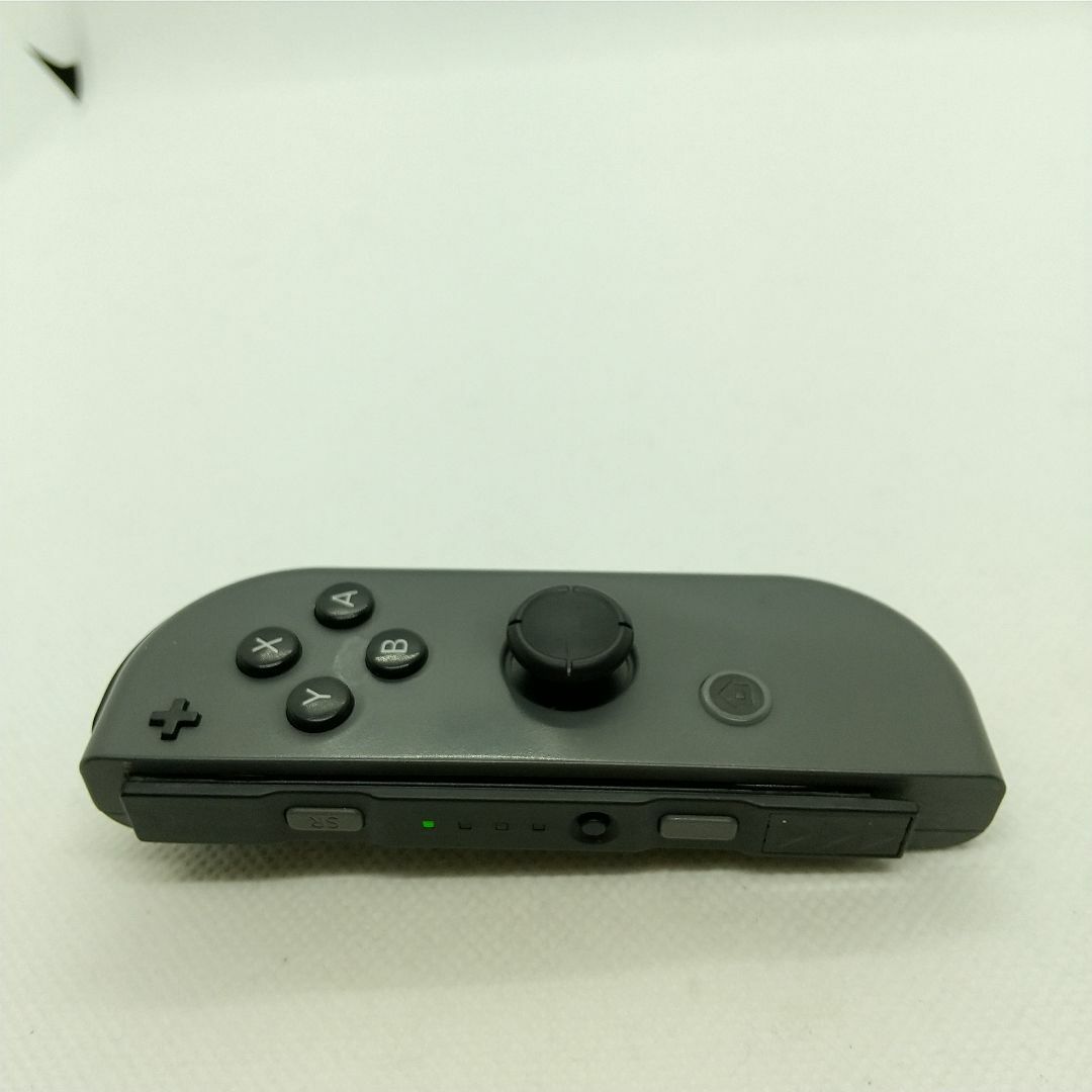 Nintendo Switch(ニンテンドースイッチ)の【廃盤】⑨Switch ジョイコン　グレー　右のみ(R)【任天堂純正品】黒色灰色 エンタメ/ホビーのゲームソフト/ゲーム機本体(家庭用ゲーム機本体)の商品写真