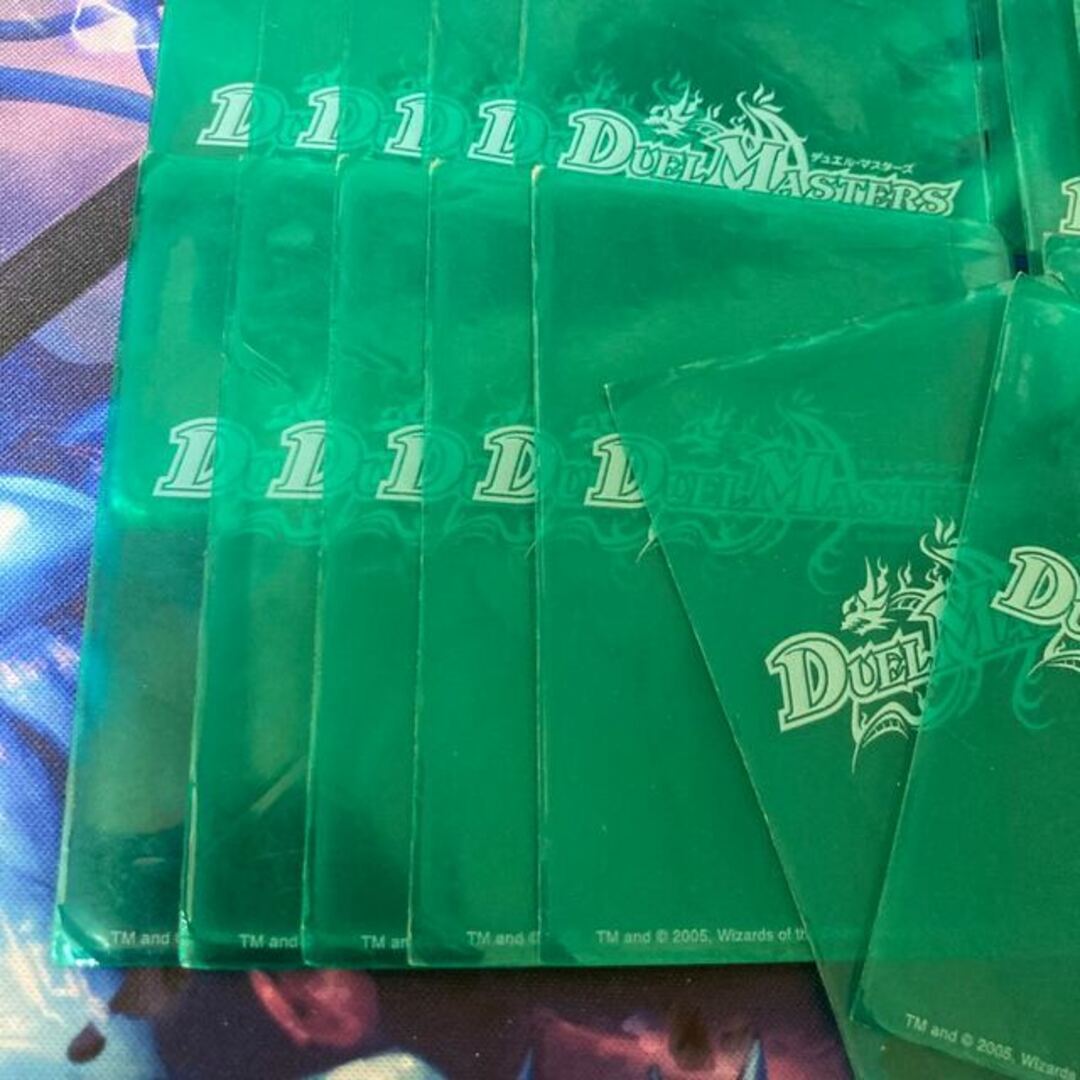 デュエルマスターズ(デュエルマスターズ)の旧公式スリーブ 緑 スケルトン 42枚 エンタメ/ホビーのトレーディングカード(シングルカード)の商品写真