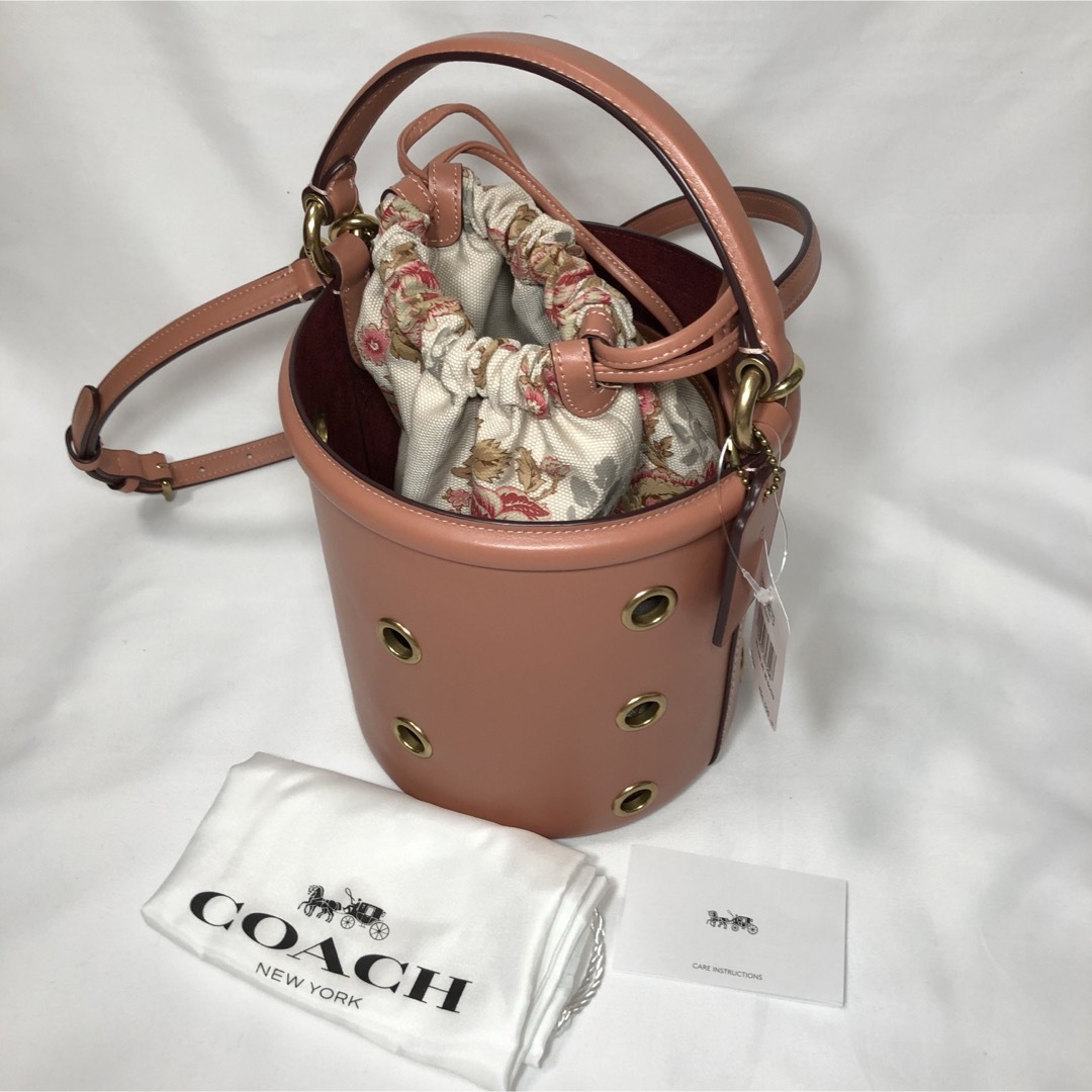 【新品】COACH ショルダーバッグ バケット グロメッツ ライトピーチ