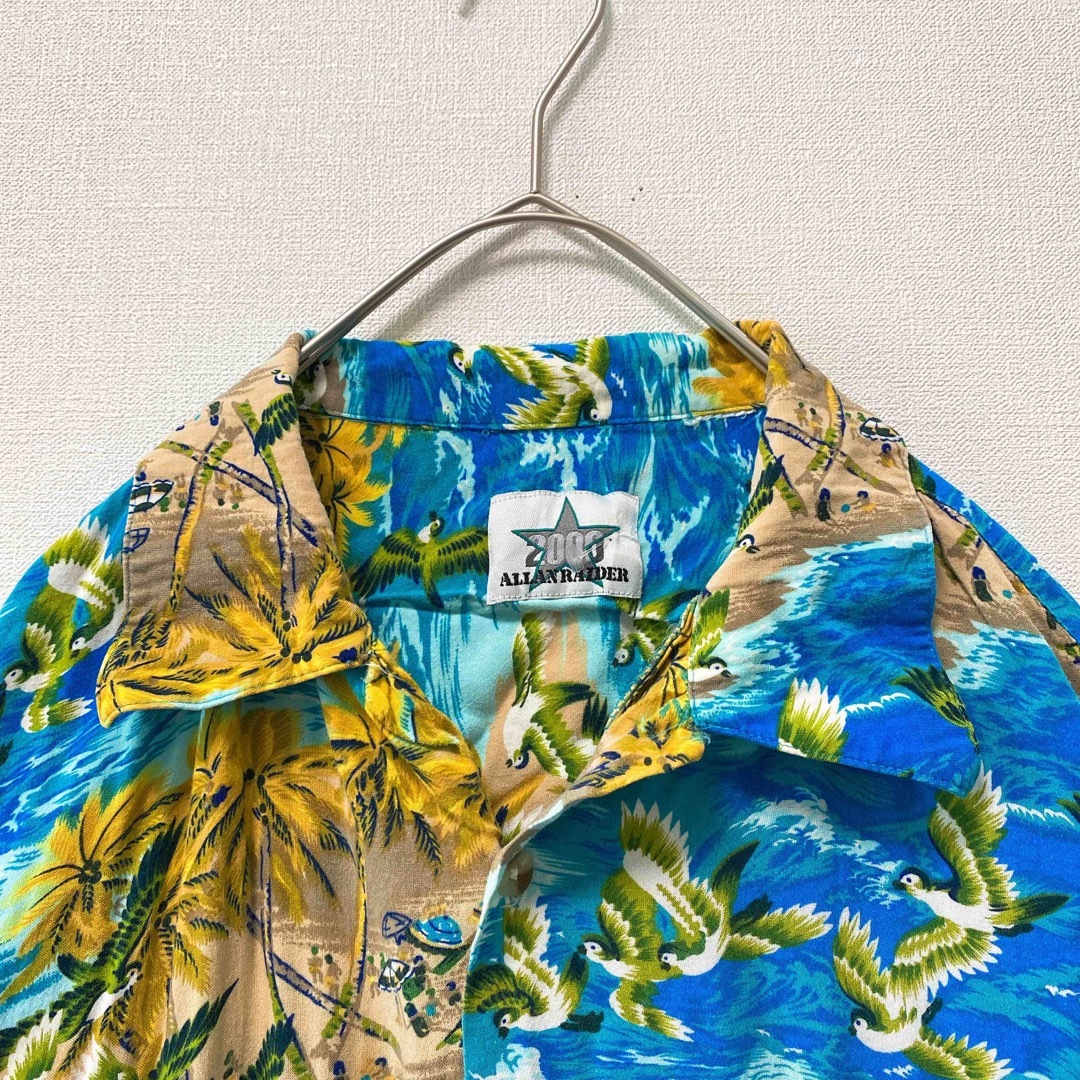 US古着　アロハシャツ　ハワイアン　半袖　総柄　風景　鳥　ヤシの木　男女兼用 メンズのトップス(シャツ)の商品写真