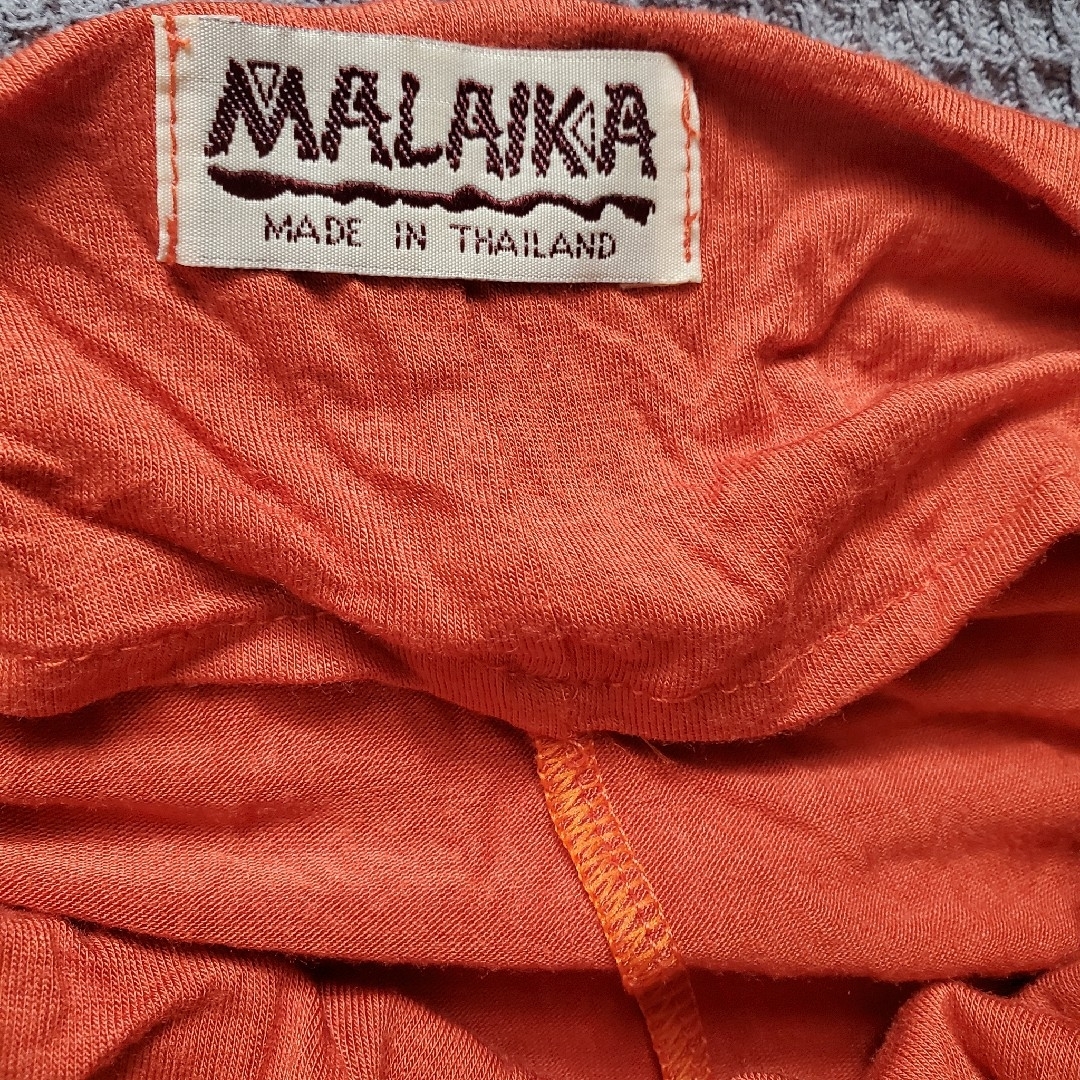 MALAIKA(マライカ)のMALAIKA  蓮オレンジ色変形ｶｯﾄｿｰ レディースのトップス(チュニック)の商品写真