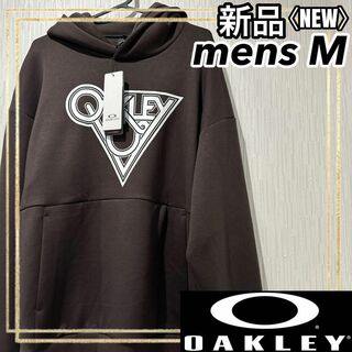 オークリー(Oakley)のOAKLEYオークリー スウェットパーカーブラウンスポーツウェア メンズM 新品(トレーニング用品)