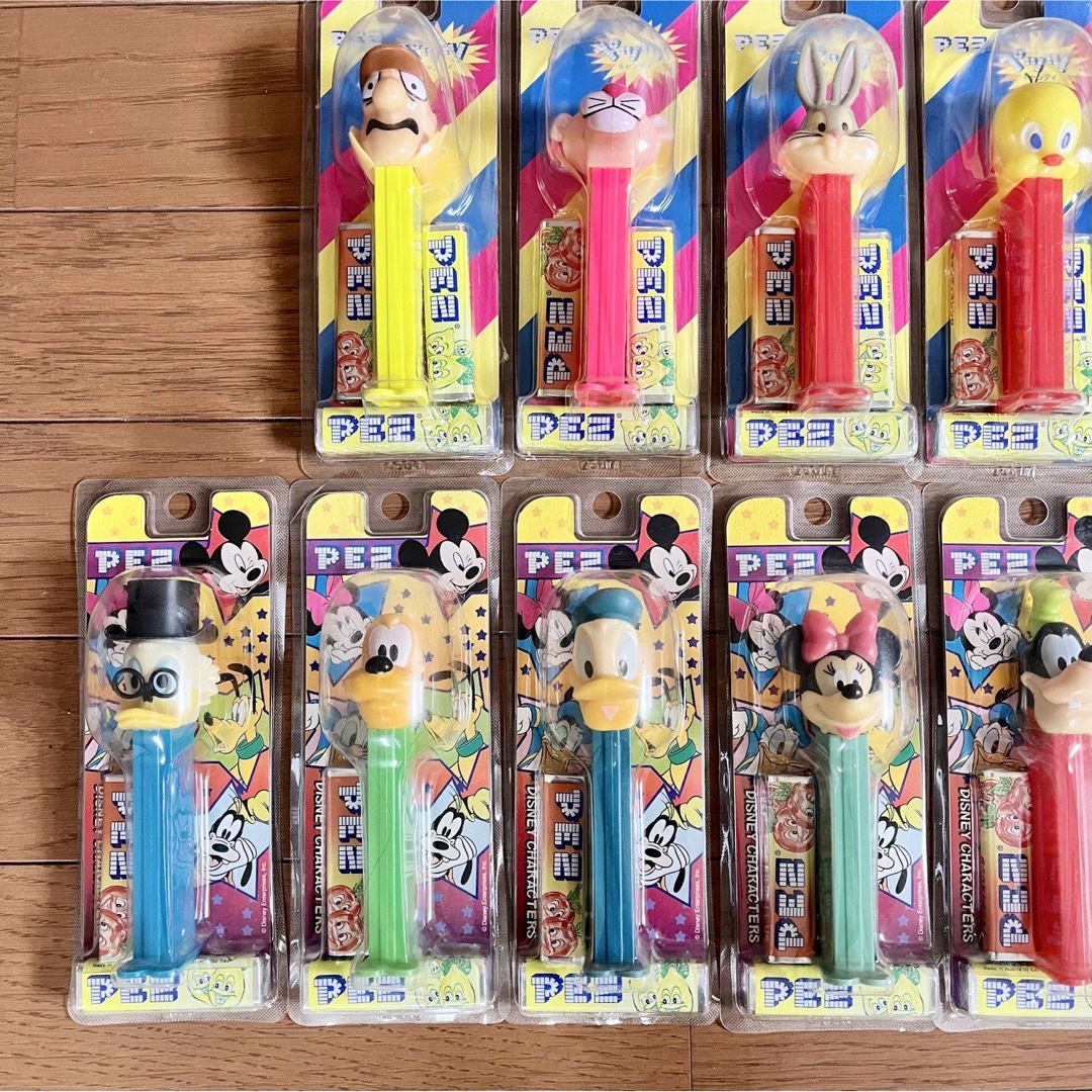 森永製菓(モリナガセイカ)の【PEZ】ペッツ 17本セット ディズニー スマーフ ワーナーブラザーズ エンタメ/ホビーのおもちゃ/ぬいぐるみ(キャラクターグッズ)の商品写真