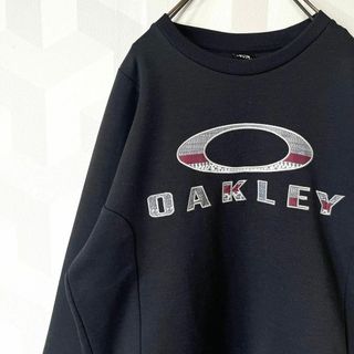 オークリー(Oakley)の【Y2K】オークリー サイズL刺繍ロゴプルオーバー スウェット 黒 oakley(スウェット)