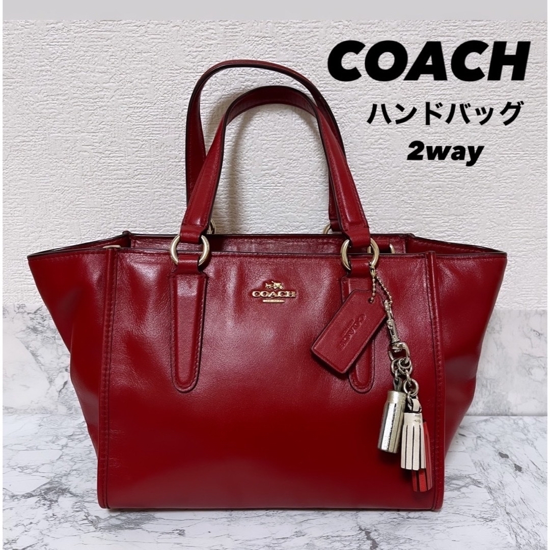 COACH(コーチ)の美品【COACH】ハンドバッグ赤2way サッチェル　レガシー　タッセル　レザー レディースのバッグ(ハンドバッグ)の商品写真