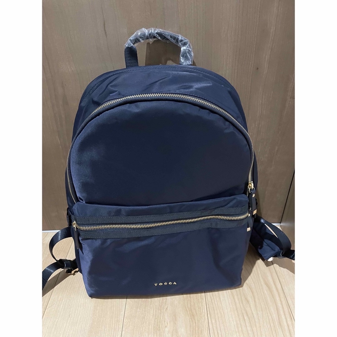 TOCCA(トッカ)のトッカ　tocca ＳＩＤＥ　ＲＩＢＢＯＮＢＡＣＫＰＡＣＫリュックサックネイビー レディースのバッグ(リュック/バックパック)の商品写真