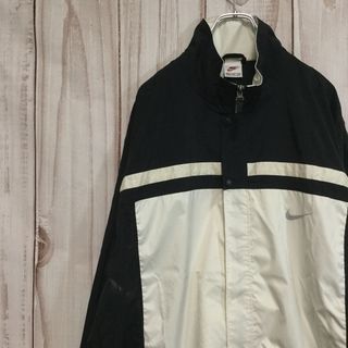 ナイキ(NIKE)の【ナイキ ナイロンジャケット】 銀タグ 背面ビッグロゴ 配色 2XL 黒 古着(ナイロンジャケット)