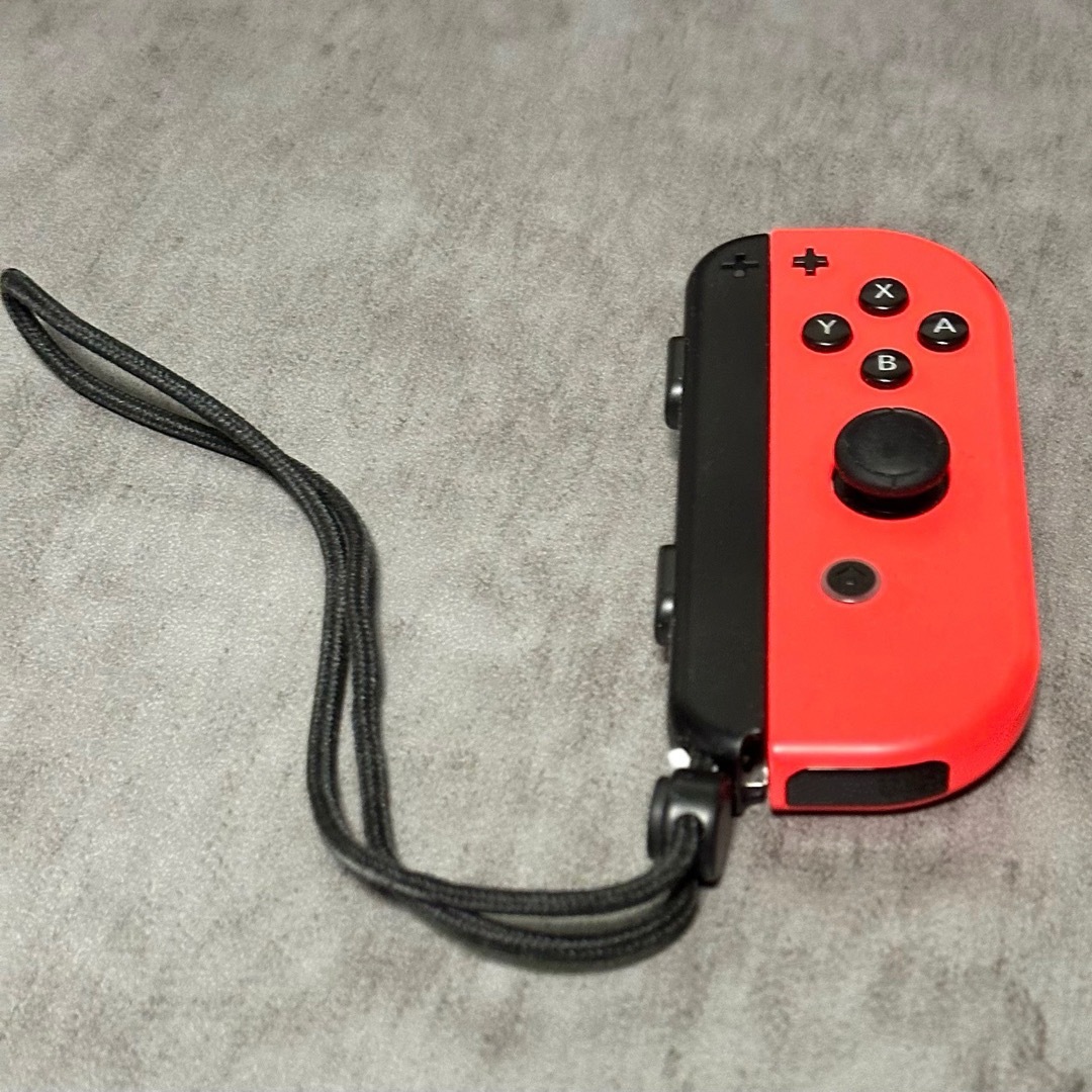 Nintendo Switch(ニンテンドースイッチ)の【Switch】ジョイコン ネオンレッド(右用)【任天堂純正品】赤 ジャンク エンタメ/ホビーのゲームソフト/ゲーム機本体(その他)の商品写真