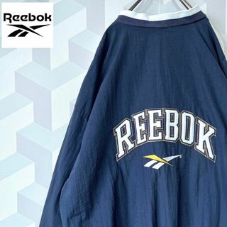 リーボック(Reebok)の【90s リーボック】バック刺繍 ナイロン プルオーバー ゲームシャツ 白青(ナイロンジャケット)