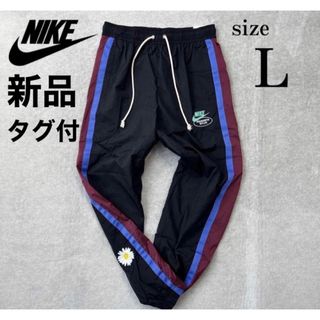 ナイキ(NIKE)の撥水加工 NIKE ナイロン パンツ ジャージ ブラック ブルー 花柄　L(その他)