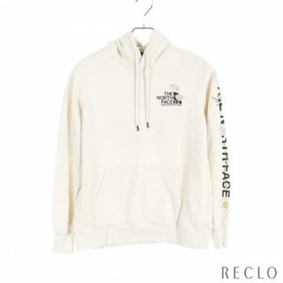 ザノースフェイス(THE NORTH FACE)の プルオーバーパーカー コットン オフホワイト フラワー ロゴプリント(パーカー)