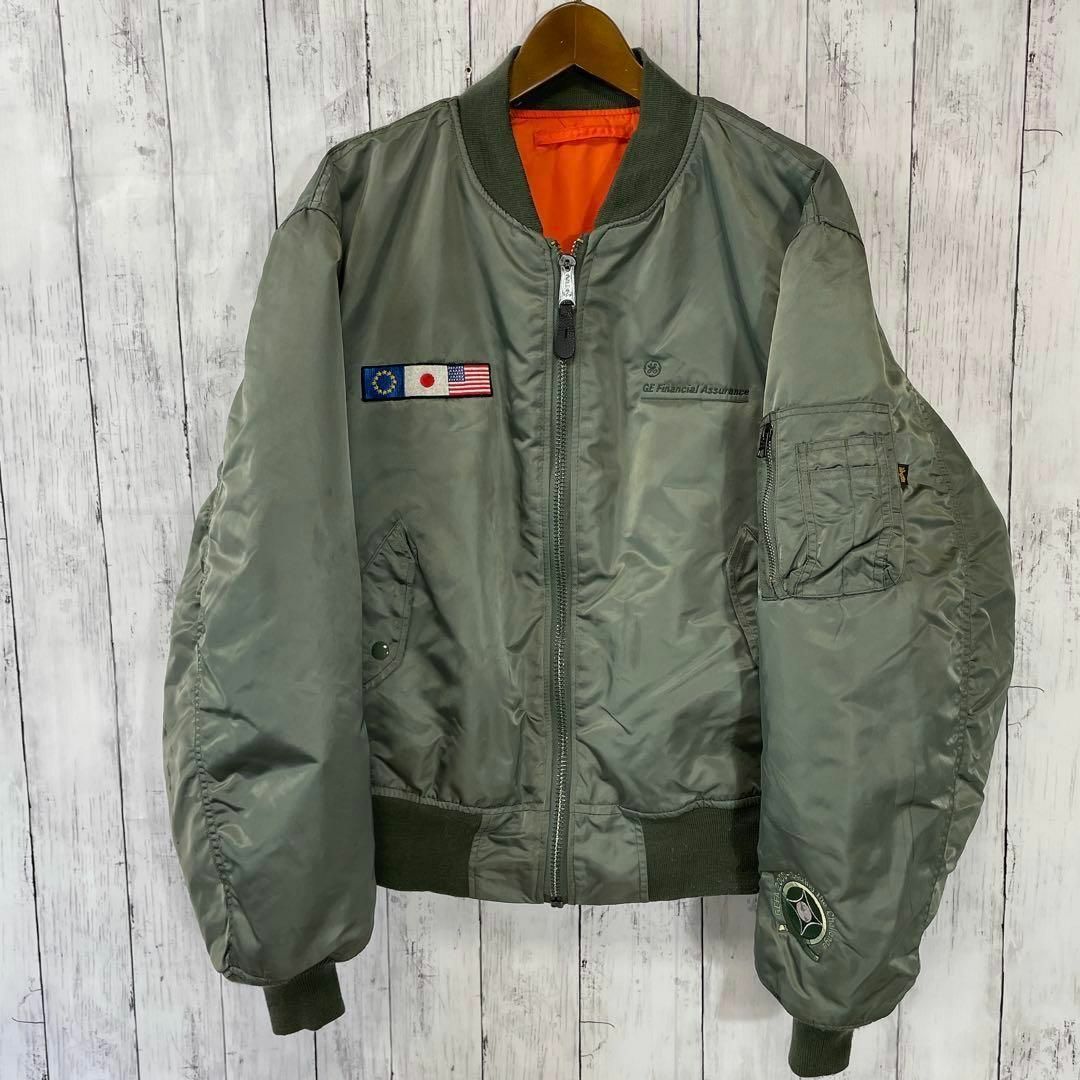 ALPHA INDUSTRIES(アルファインダストリーズ)のフライトジャケット　MA1　緑グリーン　アメリカ企業物国旗　ナイロン　メンズ古着 メンズのジャケット/アウター(フライトジャケット)の商品写真