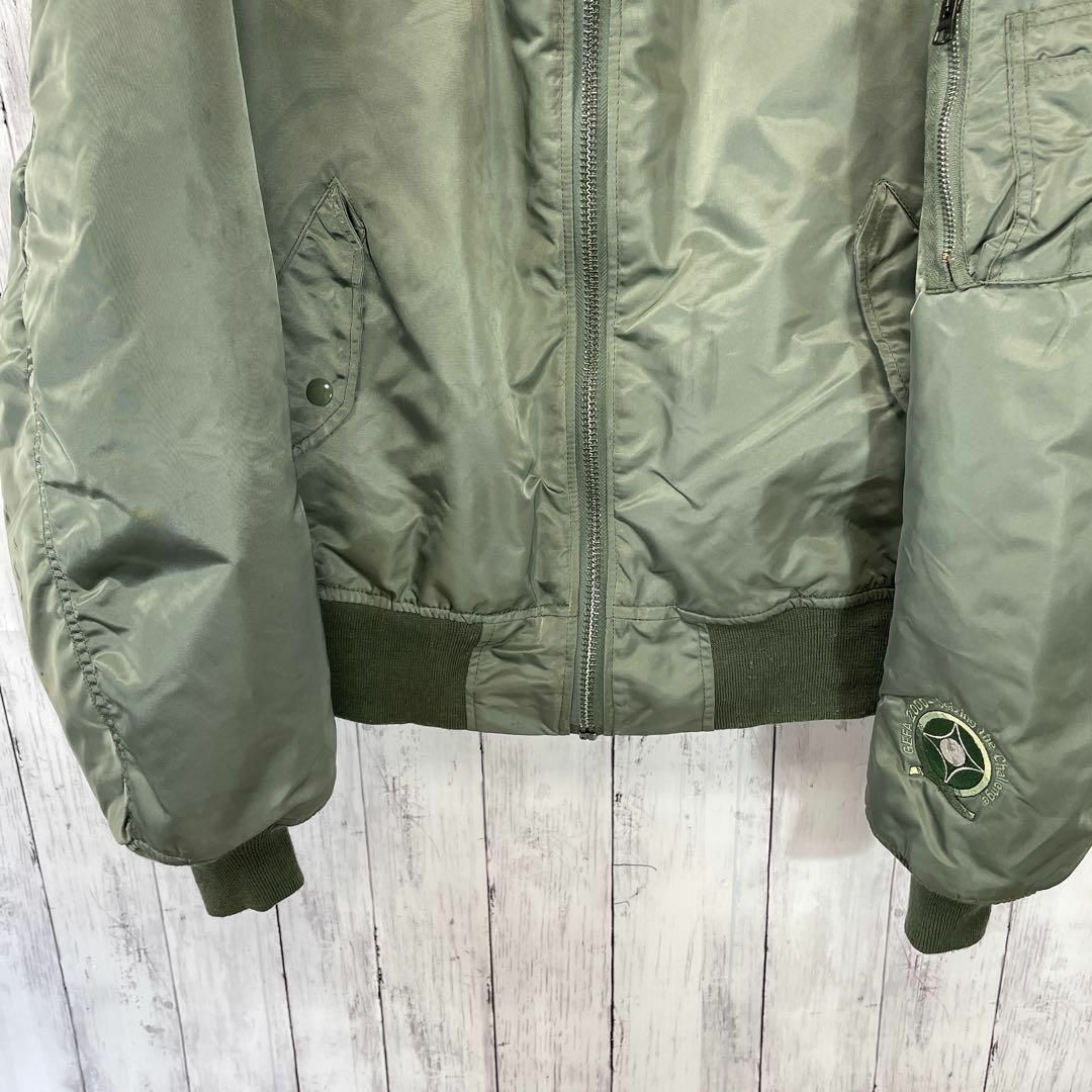 ALPHA INDUSTRIES(アルファインダストリーズ)のフライトジャケット　MA1　緑グリーン　アメリカ企業物国旗　ナイロン　メンズ古着 メンズのジャケット/アウター(フライトジャケット)の商品写真