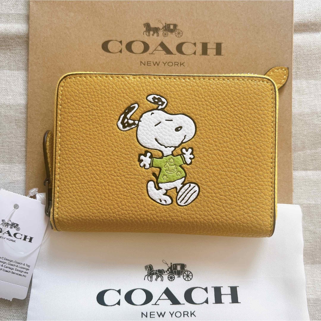 新品/予約受付 COACH コーチ ファスナー二つ折り財布 スヌーピー