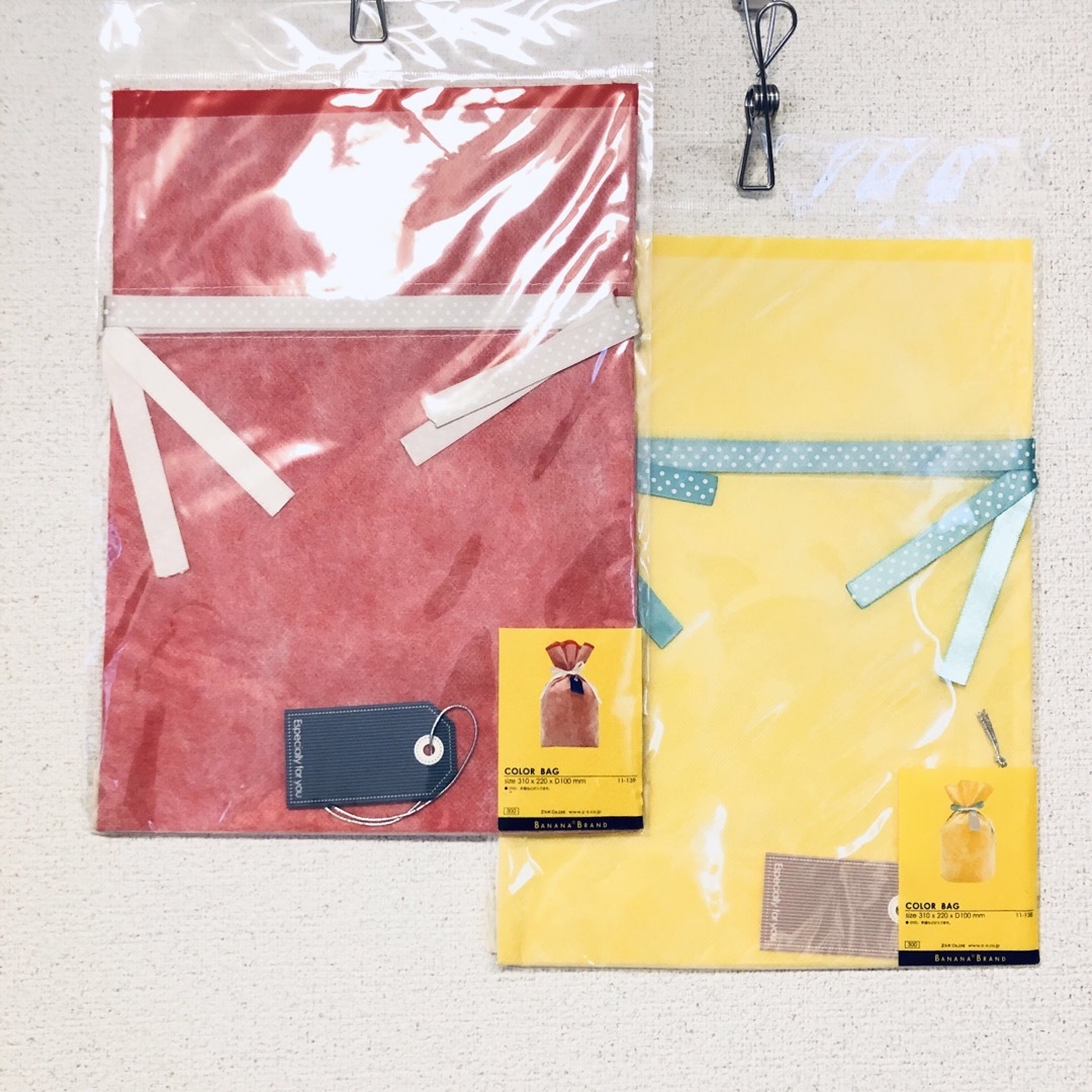 【新品】ラッピングバッグ ・中サイズ・2色セット・巾着 不織布・包装 袋・黄・赤 インテリア/住まい/日用品のオフィス用品(ラッピング/包装)の商品写真