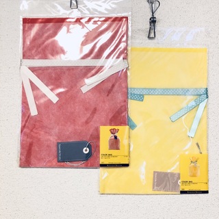 【新品】ラッピングバッグ ・中サイズ・2色セット・巾着 不織布・包装 袋・黄・赤(ラッピング/包装)