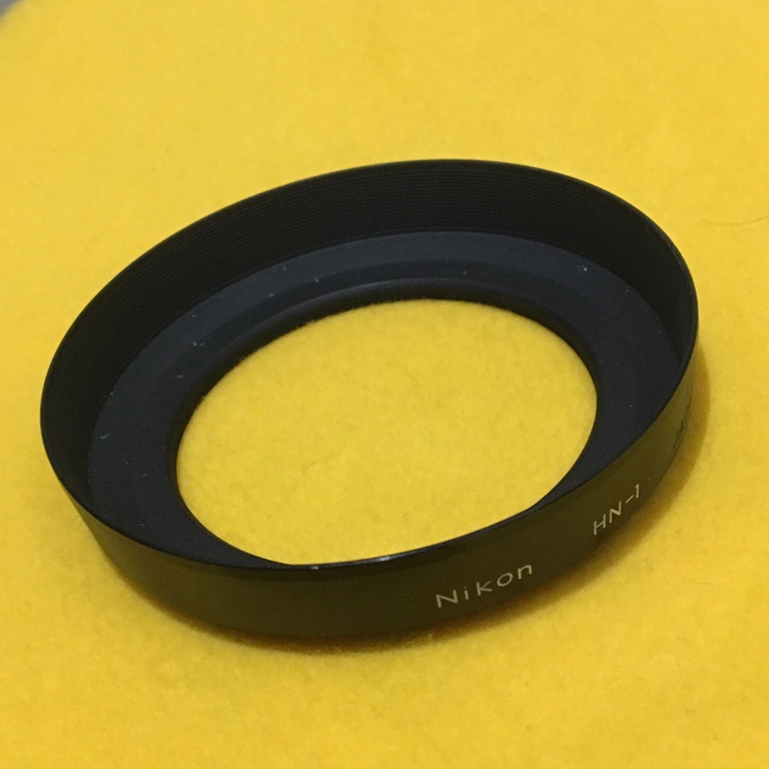 Nikon(ニコン)のNIKON 廃番品 HN-1 旧製品 Φ52mm 広角ネジ込 金属フード 旧ロゴ スマホ/家電/カメラのカメラ(レンズ(単焦点))の商品写真