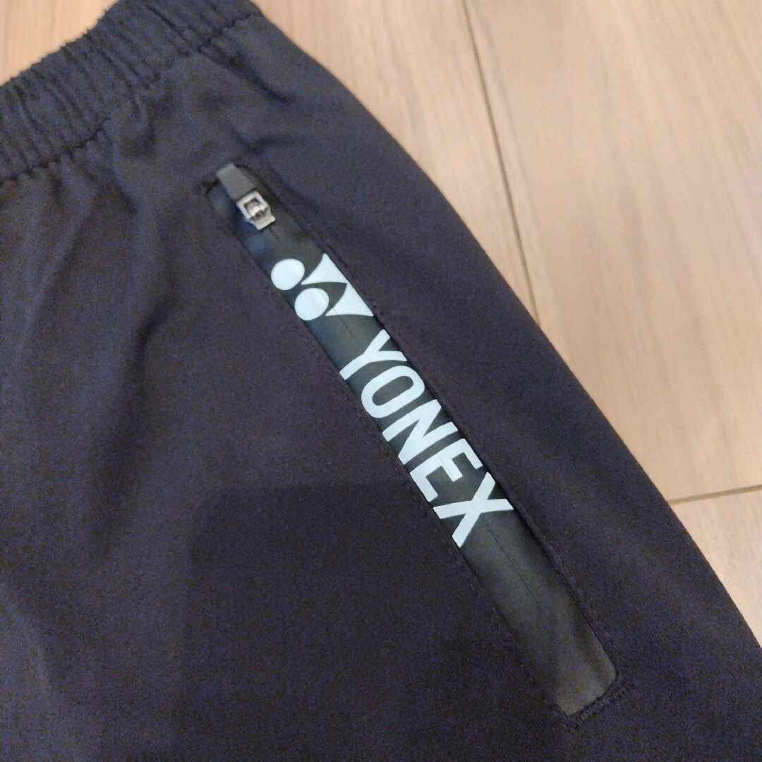 YONEX(ヨネックス)のYONEX　七分丈パンツ　ブラック/オレンジ　L スポーツ/アウトドアのスポーツ/アウトドア その他(バドミントン)の商品写真