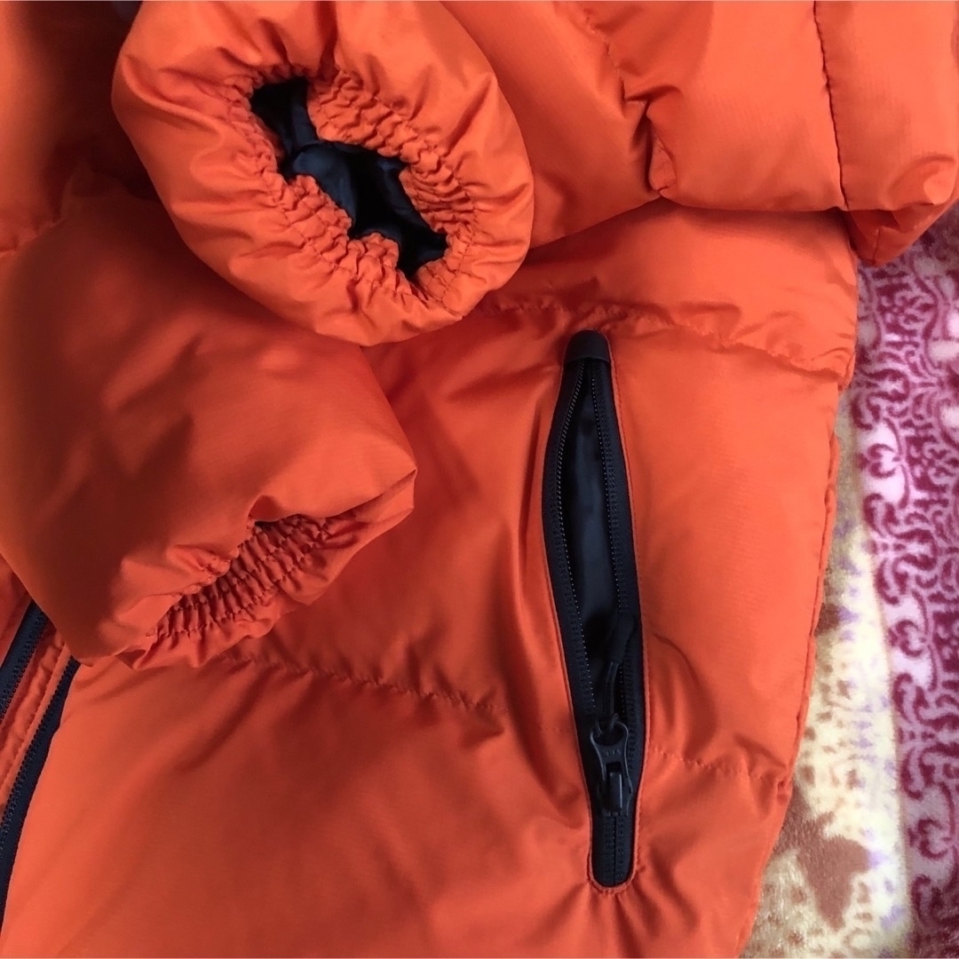 GU(ジーユー)のGUの防風防寒パーカ パフジャケット  撥水加工 表記S (M相当)オレンジ　 メンズのジャケット/アウター(マウンテンパーカー)の商品写真