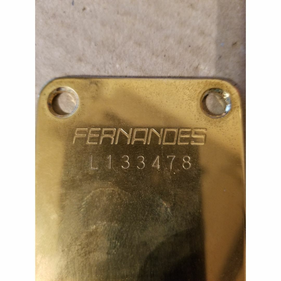 Fernandes(フェルナンデス)の【送込、中古】 Fernandes 、ネックジョイントプレート、金、傷Noあり 楽器のギター(パーツ)の商品写真