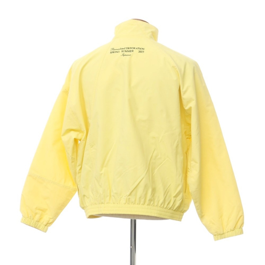 Supreme(シュプリーム)の【中古】シュプリーム Supreme 2023年春夏 Bernadette Corporation Track Jacket ナイロン トラックジャケット ブルゾン クリームイエロー【サイズM】【メンズ】 メンズのジャケット/アウター(マウンテンパーカー)の商品写真