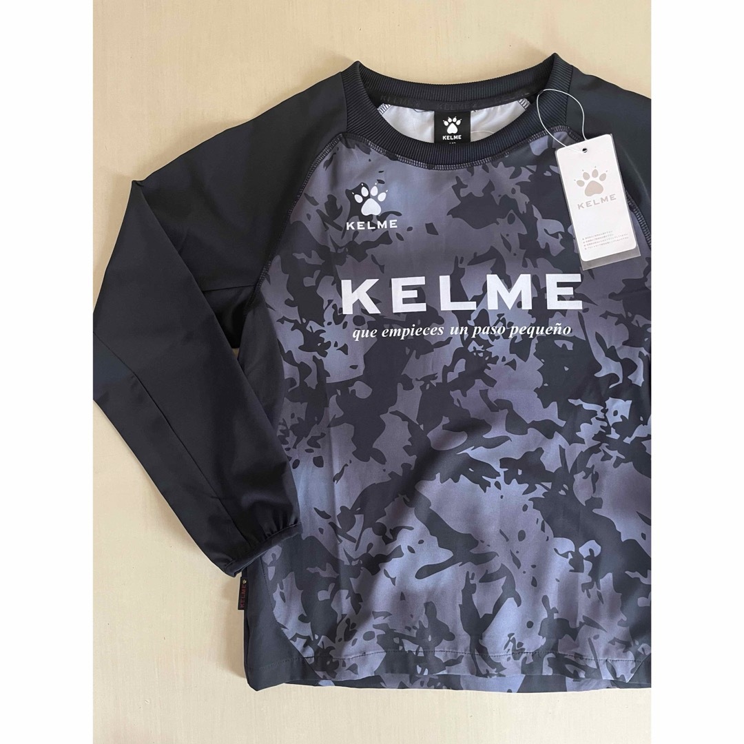 KELME(ケルメ)の新品タグ付き　150cm KELMEケルメ トレーニングピステスーツ ブラック スポーツ/アウトドアのサッカー/フットサル(ウェア)の商品写真