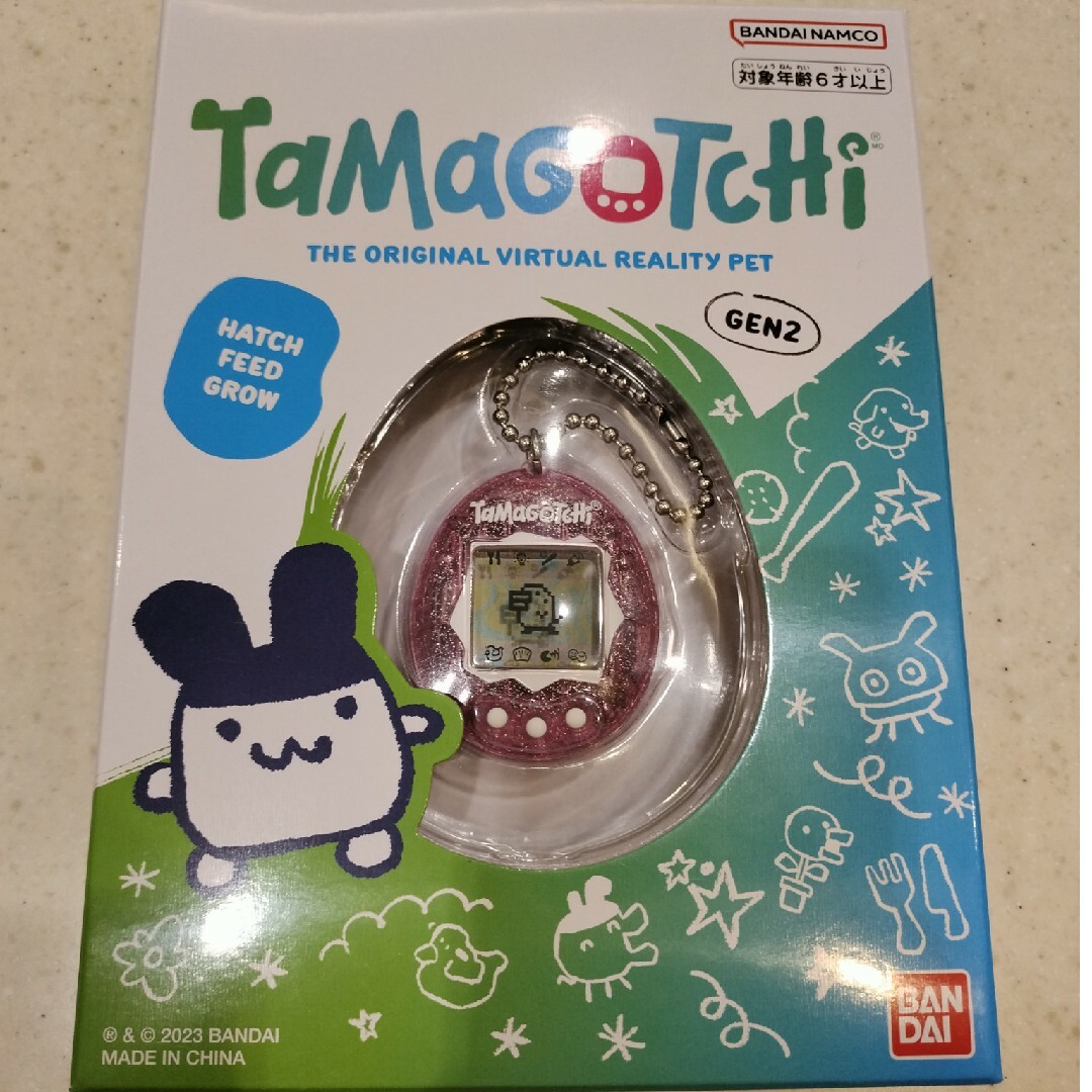 BANDAI(バンダイ)のOriginal Tamagotchi Pink Glitter(1個) キッズ/ベビー/マタニティのおもちゃ(その他)の商品写真