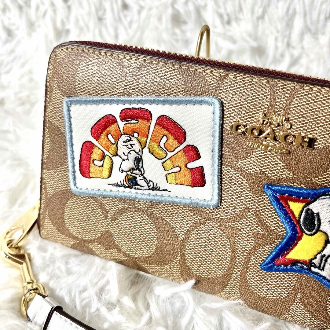 COACH(コーチ)の新品タグ付き✨COACH コーチ　スヌーピー限定コラボ　長財布　シグネチャー レディースのファッション小物(財布)の商品写真