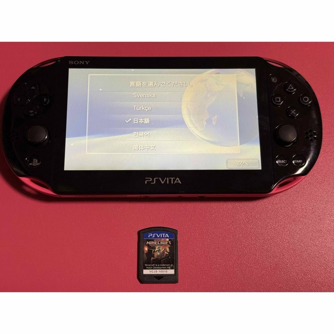 PlayStation Vita(プレイステーションヴィータ)のvita  ピンクブラック　マイクラ　1 エンタメ/ホビーのゲームソフト/ゲーム機本体(携帯用ゲーム機本体)の商品写真