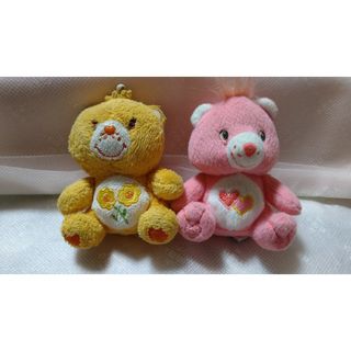 ケアベア(CareBears)の黄色ケアベアとピンクケアベアのストラップぬいぐるみ(キャラクターグッズ)