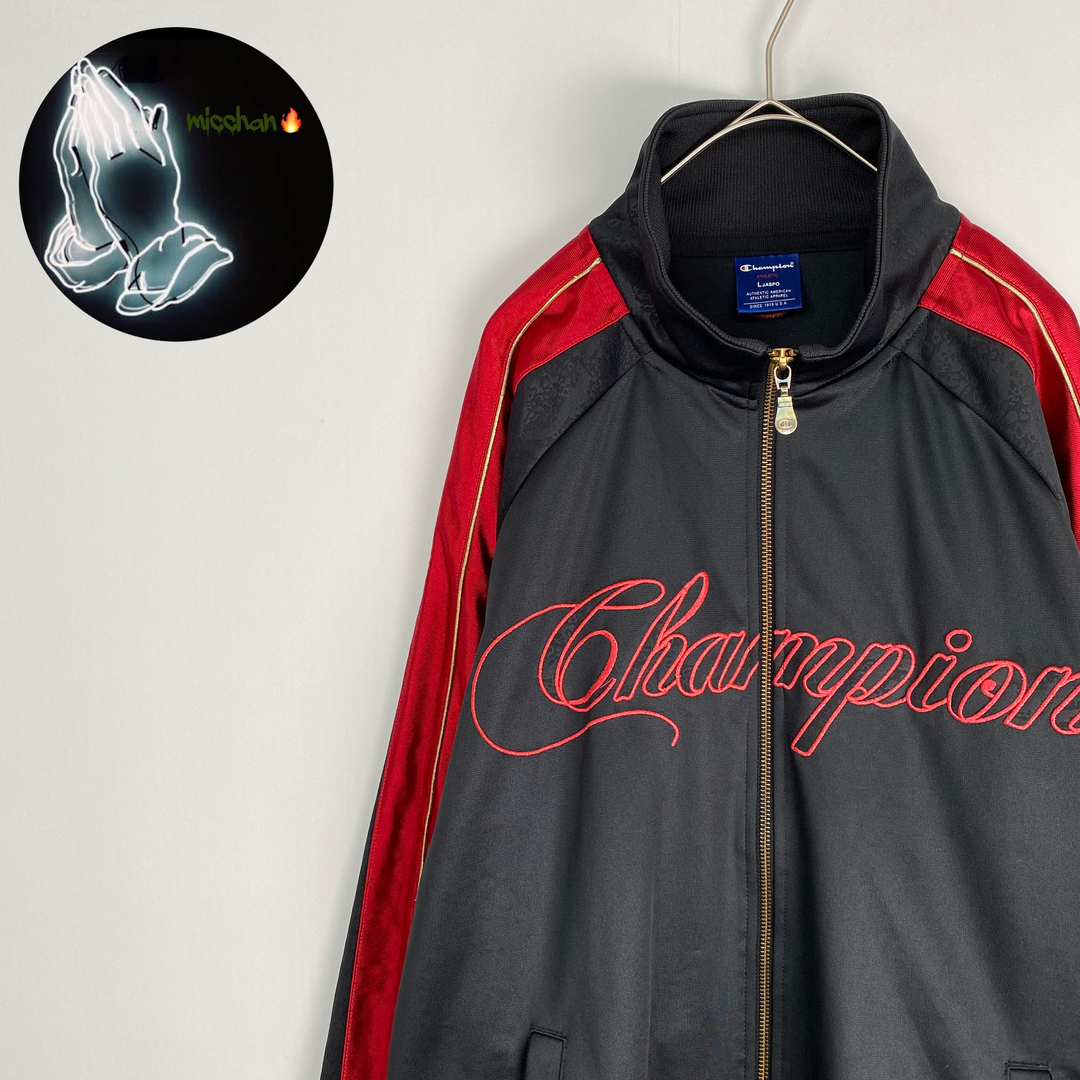 Champion(チャンピオン)の【チャンピオン　トラックジャケット　刺しゅうデザイン　ラグラン袖　黒　赤　古着】 メンズのジャケット/アウター(その他)の商品写真