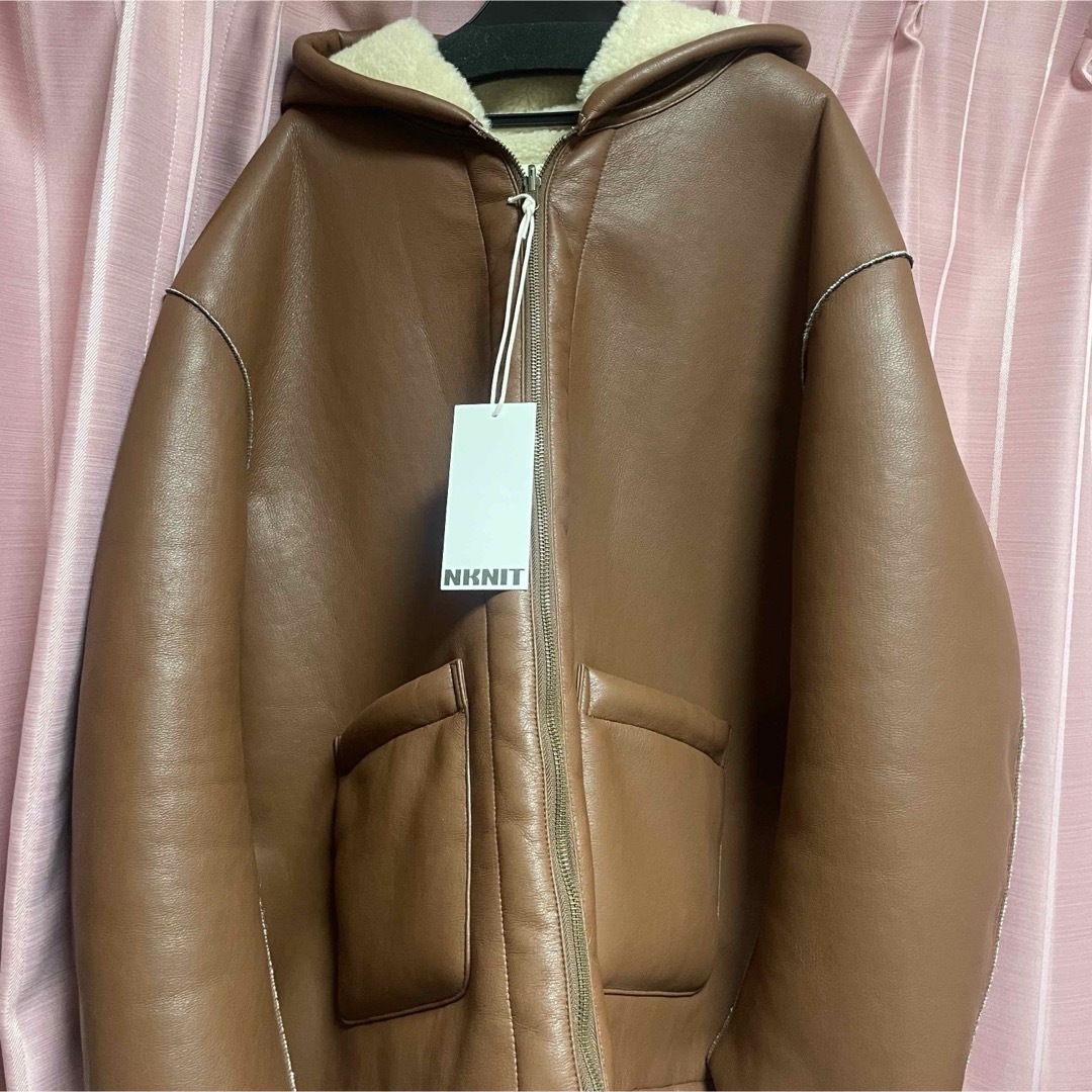 Acne Studios(アクネストゥディオズ)の【新品】NKNIT vegan mouton hooded zip jacket メンズのジャケット/アウター(レザージャケット)の商品写真