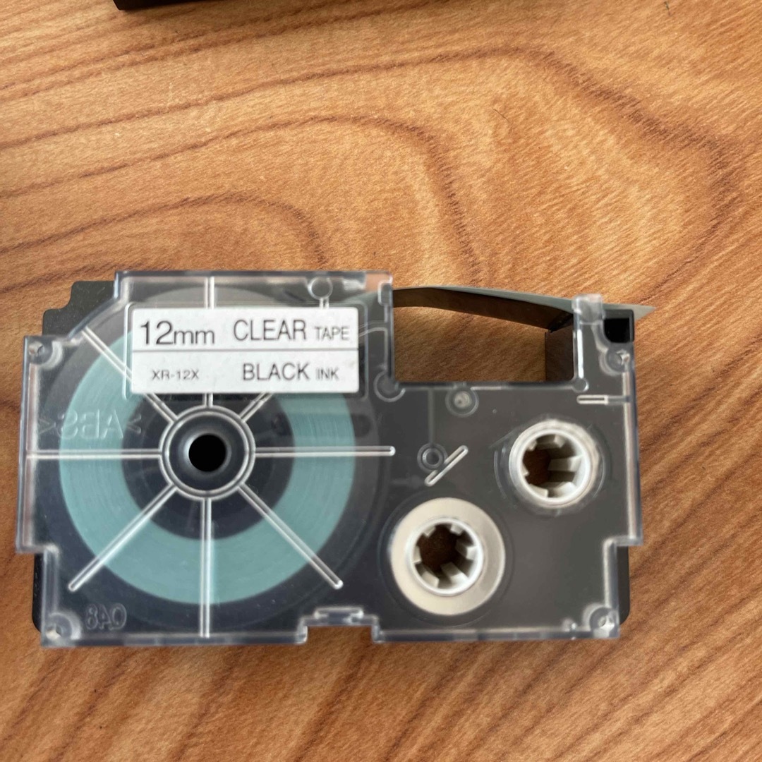 カシオ ネームランドテープカートリッジ 12mm XR-12X 黒文字／透明テー インテリア/住まい/日用品のオフィス用品(OA機器)の商品写真