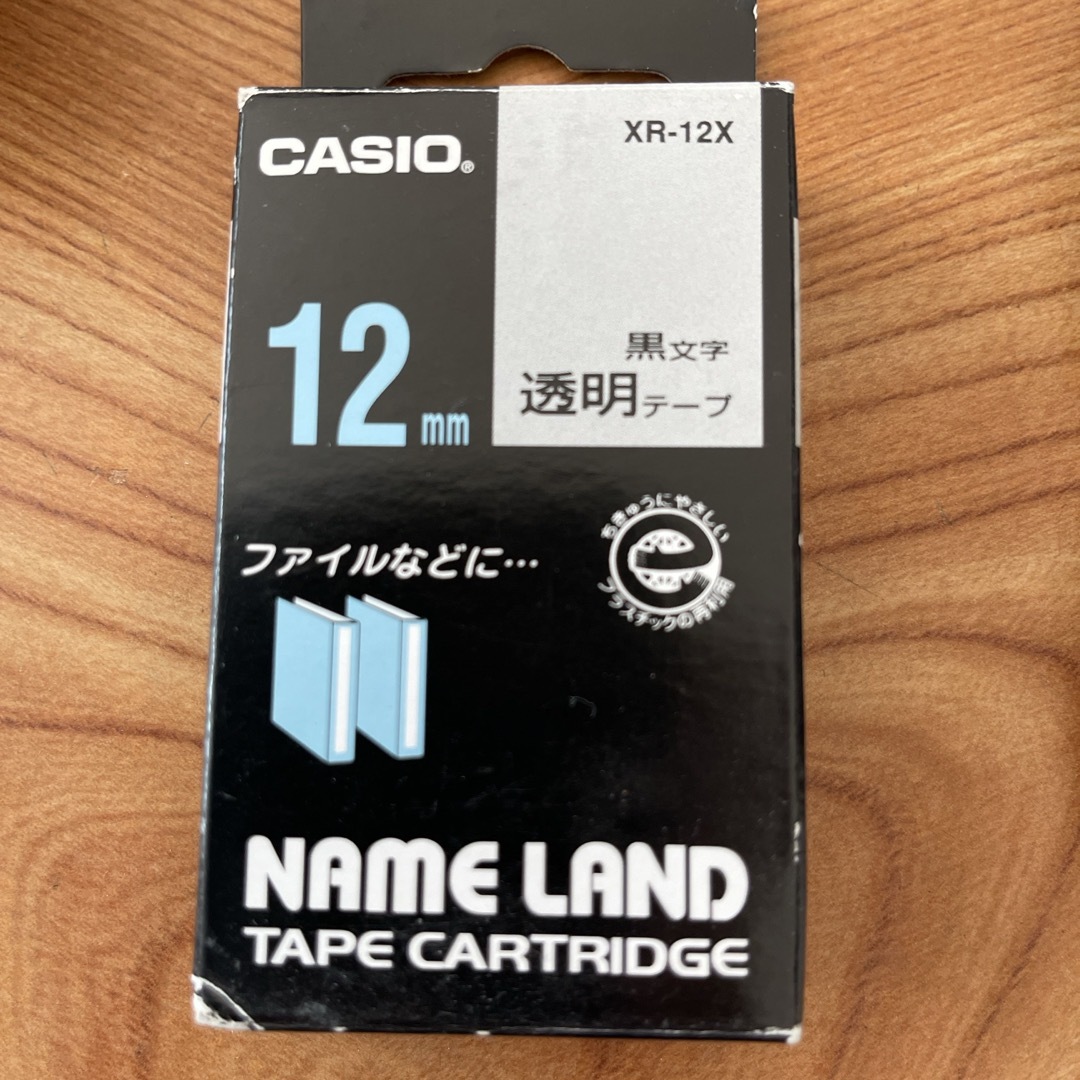 カシオ ネームランドテープカートリッジ 12mm XR-12X 黒文字／透明テー インテリア/住まい/日用品のオフィス用品(OA機器)の商品写真