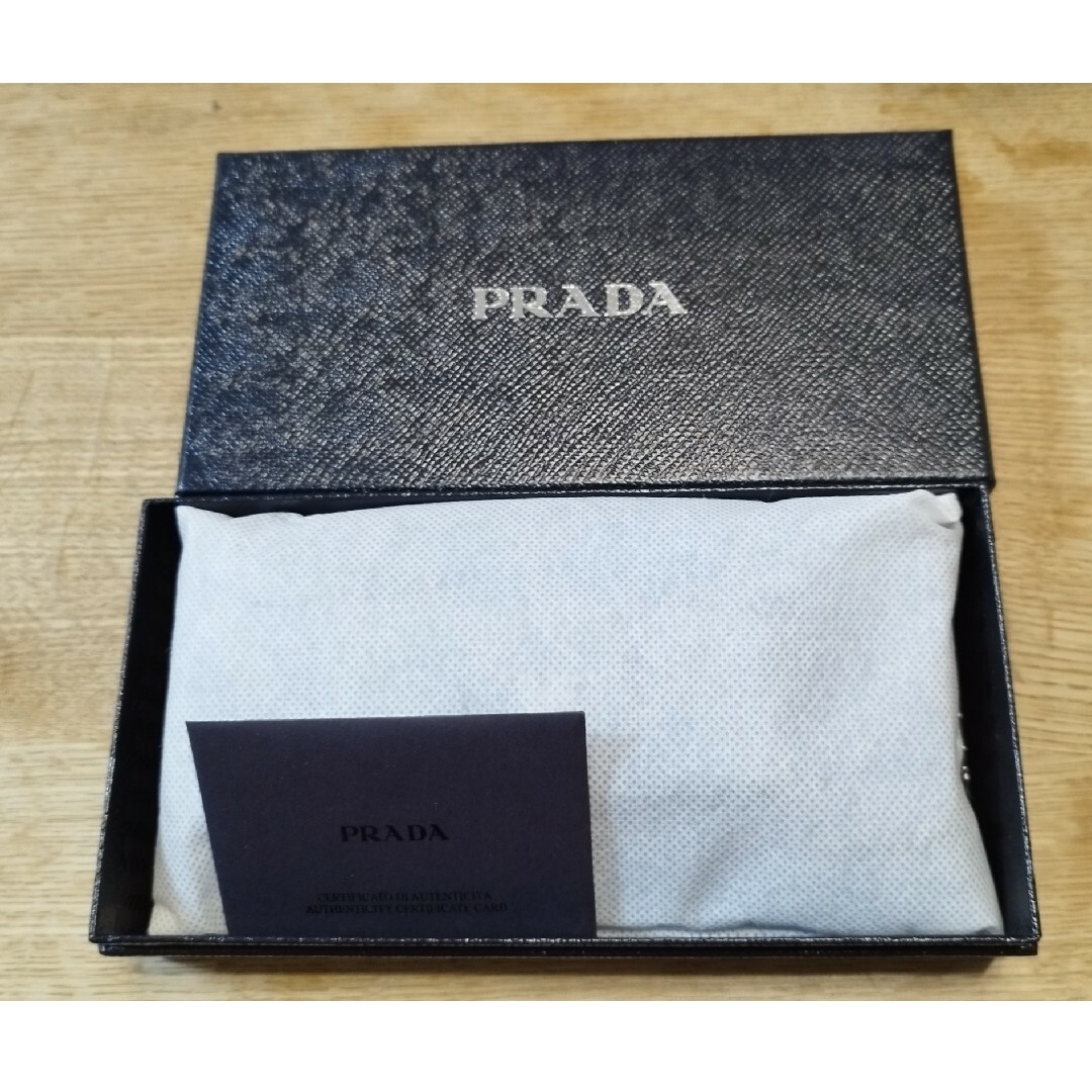 PRADA(プラダ)の【PRADA】プラダ 二つ折り長財布 リボン サフィアーノ ライトブルー メンズのファッション小物(長財布)の商品写真