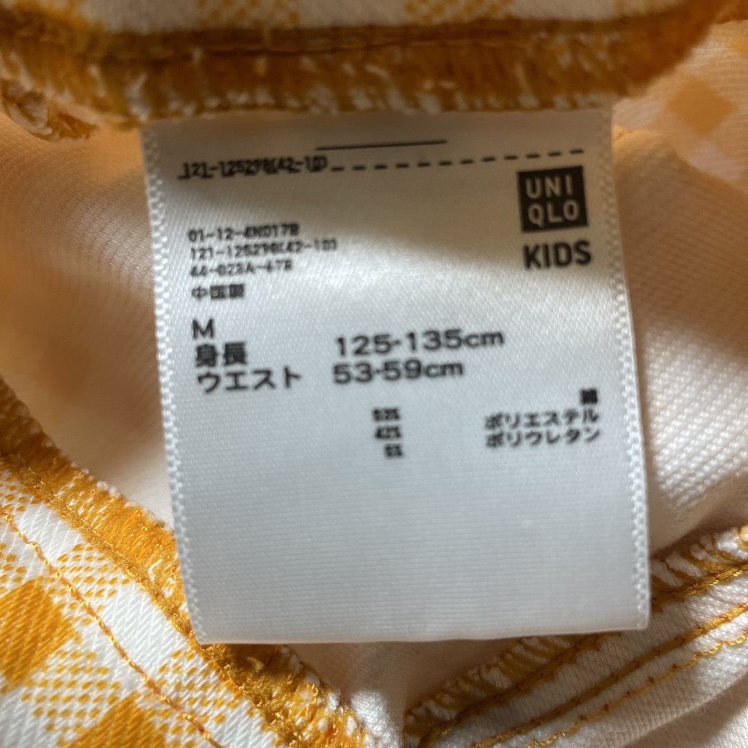 UNIQLO(ユニクロ)のUNIQLO ユニクロ　Mサイズ　七分丈　パンツ　鮮やかオレンジ キッズ/ベビー/マタニティのキッズ服女の子用(90cm~)(パンツ/スパッツ)の商品写真