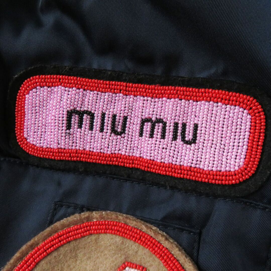 miumiu(ミュウミュウ)の美品◎正規品 イタリア製 MIUMIU ミュウミュウ M6435 レディース ラクーンファー・フード付き ボンバージャケット ビーズ刺繍 ネイビー 40 レディースのジャケット/アウター(その他)の商品写真