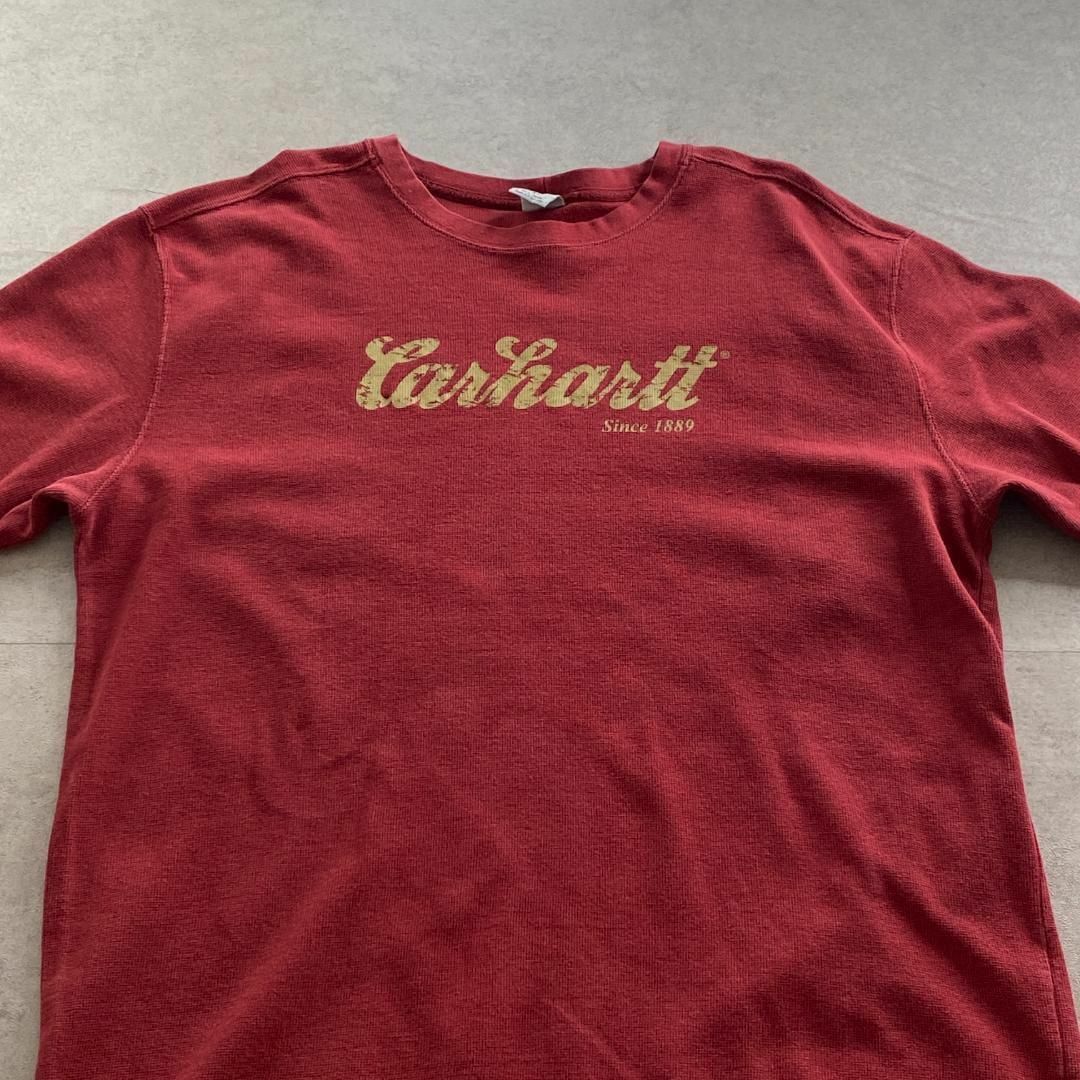 carhartt(カーハート)のカーハート　長袖カットソー　プリントロゴ　ブランドロゴ　古着　レッド　XL メンズのトップス(Tシャツ/カットソー(七分/長袖))の商品写真