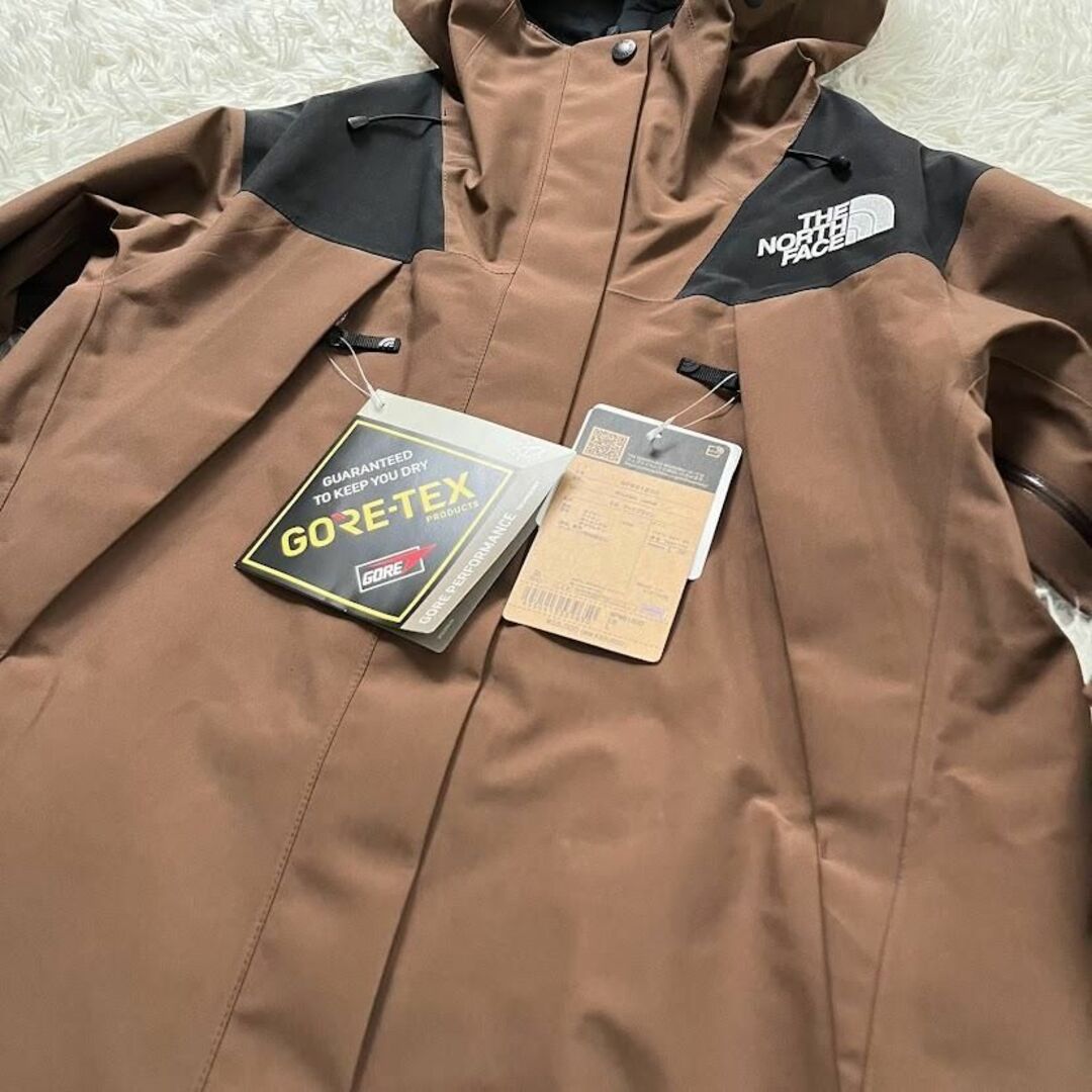 THE NORTH FACE(ザノースフェイス)の新品　 NPW61800　ノースフェイス マウンテンジャケット アースブラウン レディースのジャケット/アウター(ナイロンジャケット)の商品写真