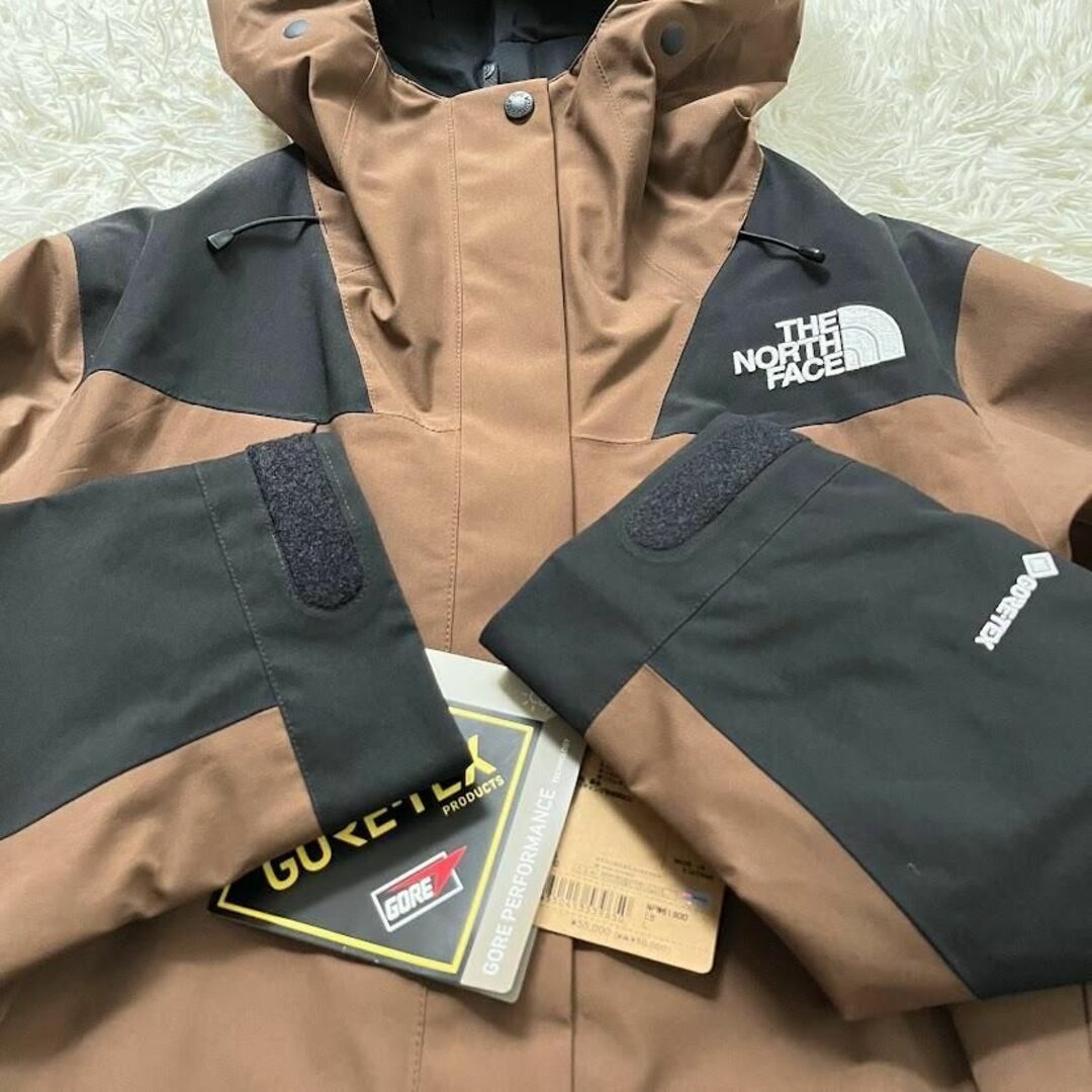 THE NORTH FACE(ザノースフェイス)の新品　 NPW61800　ノースフェイス マウンテンジャケット アースブラウン レディースのジャケット/アウター(ナイロンジャケット)の商品写真