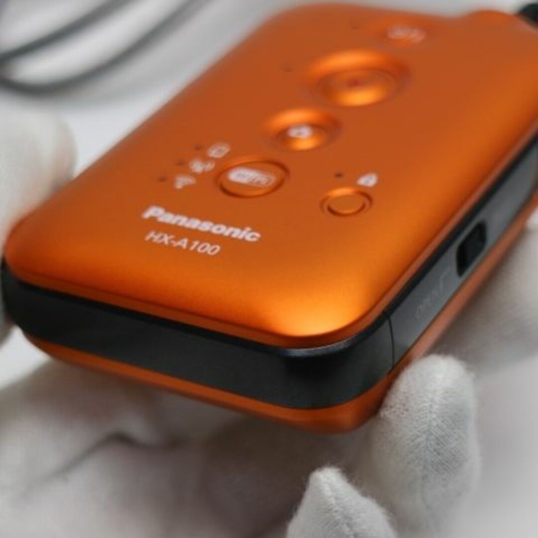 Panasonic(パナソニック)の新品同様 HX-A100 オレンジ  M777 スマホ/家電/カメラのカメラ(ビデオカメラ)の商品写真