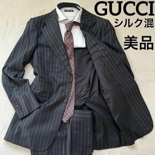 グッチ(Gucci)の112美品　グッチ　スーツセット　46表記(M位) 黒　ストライプ　シルク混(セットアップ)