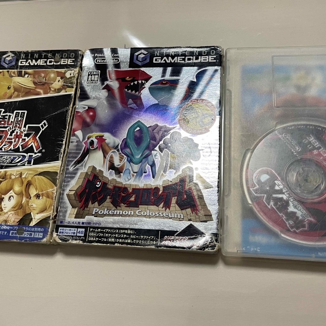 ニンテンドーゲームキューブ(ニンテンドーゲームキューブ)のポケモンコロシアム、ポケモンXDダークルギア、大乱闘スマッシュブラザーズ エンタメ/ホビーのゲームソフト/ゲーム機本体(家庭用ゲームソフト)の商品写真