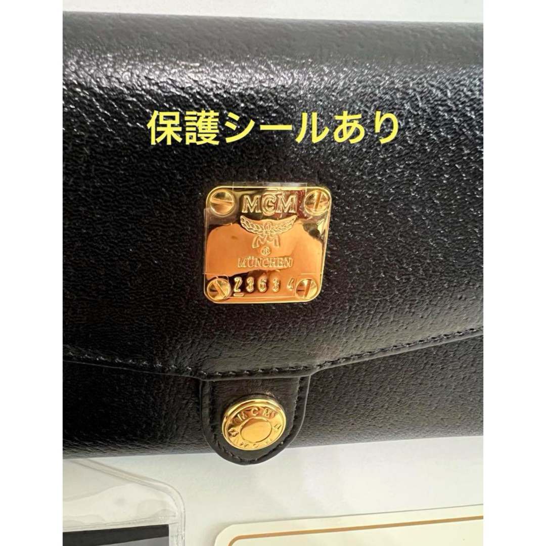 MCM(エムシーエム)の【新品未使用】MCM 折り畳み財布　黒　金　ゴールド レディースのファッション小物(財布)の商品写真