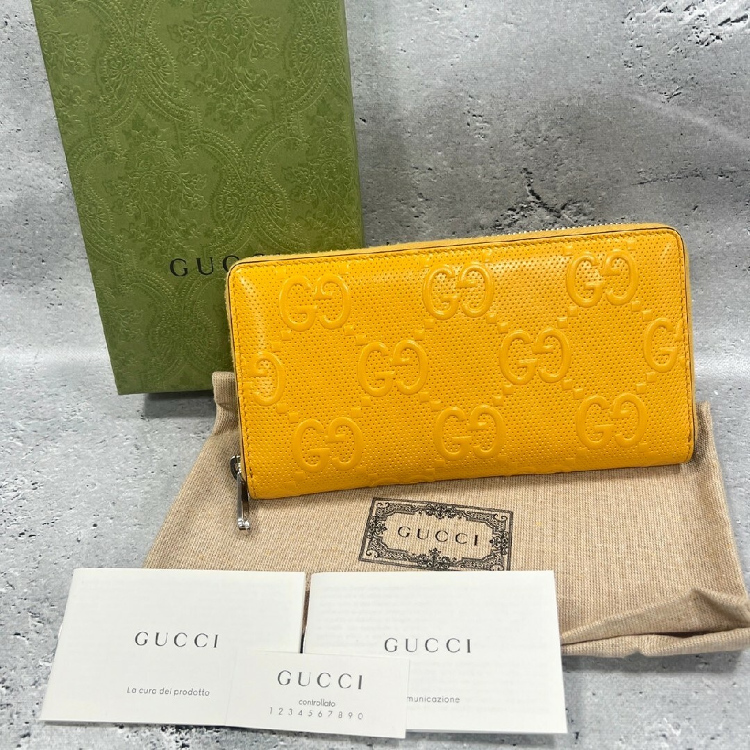 Gucci(グッチ)のグッチ GGエンボスレザー ジップアランドウォレット 長財布 イエロー ロゴ メンズのファッション小物(長財布)の商品写真