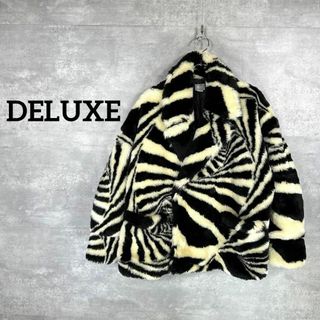 デラックス(DELUXE)の『DELUXE』デラックス (S)  ゼブラ柄 フェイクファージャケット(その他)