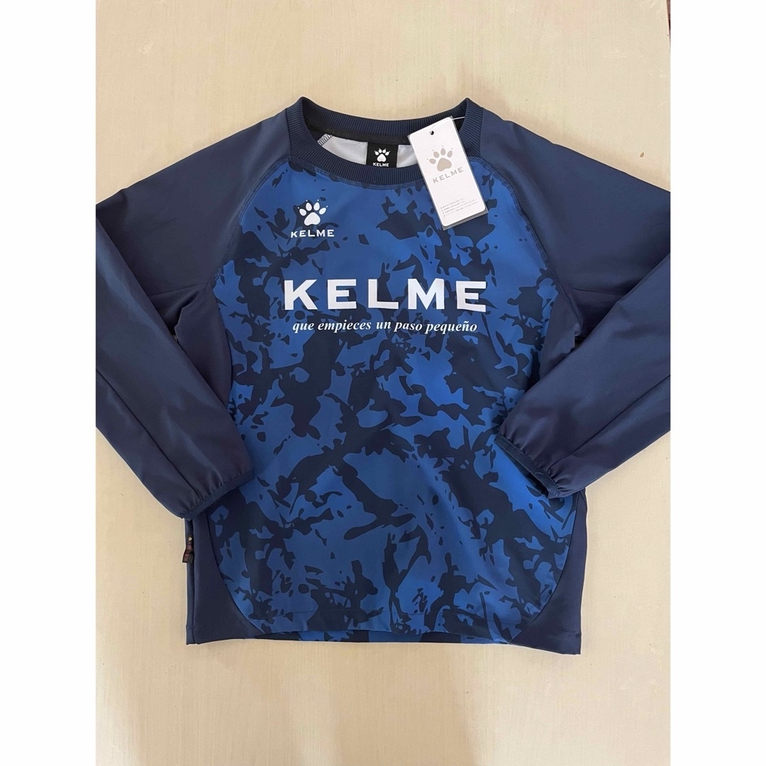 KELME(ケルメ)の新品タグ付き　150cm KELMEケルメ トレーニングピステスーツ ネイビー スポーツ/アウトドアのサッカー/フットサル(ウェア)の商品写真