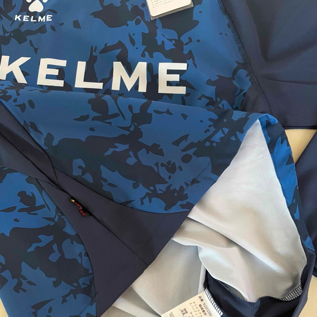 KELME(ケルメ)の新品タグ付き　150cm KELMEケルメ トレーニングピステスーツ ネイビー スポーツ/アウトドアのサッカー/フットサル(ウェア)の商品写真