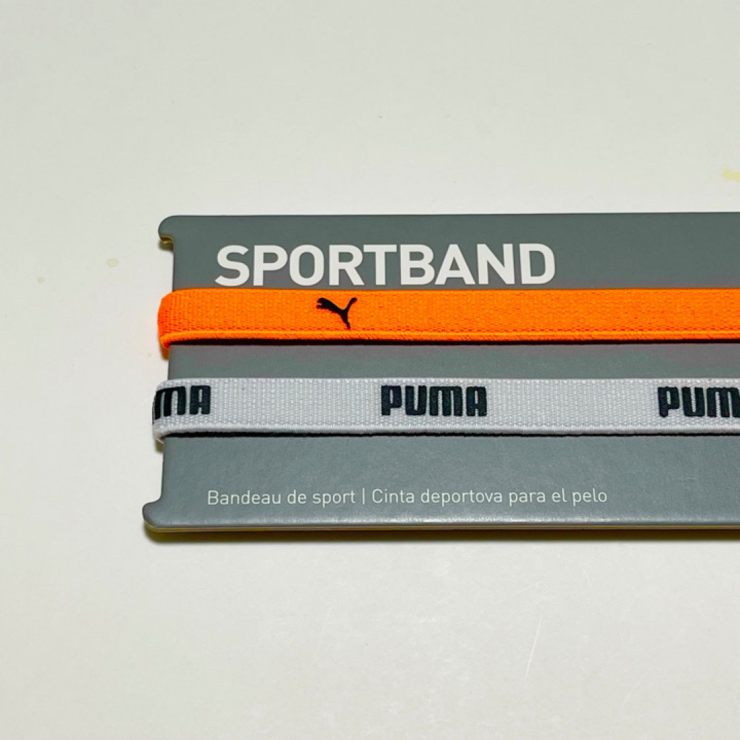 PUMA(プーマ)の新品・送料無料 PUMA 細いヘアバンド 2本セット オレンジ　ホワイト スポーツ/アウトドアのサッカー/フットサル(その他)の商品写真